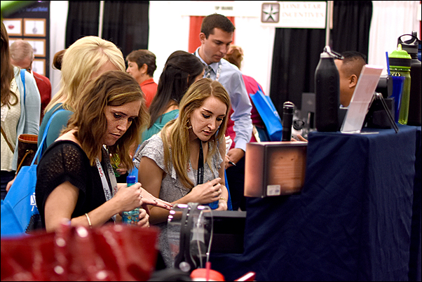 SAGE Show attendees browse of the more than 225 exhibitor booths on the show floor.