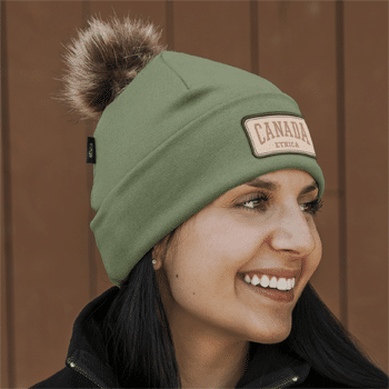 sage green Unisex Pom Pom Toque beanie with forehead logo patch and faux-fur pom from the Attraction union-made Ethica collection