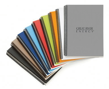 array of brightly colored spiral notebooks made with recycled materials by Spector & Co.