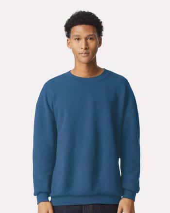 man wearing blue sweatshirt by American Apparel